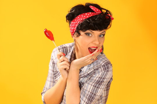 pin up girl with heart shaped lollipop