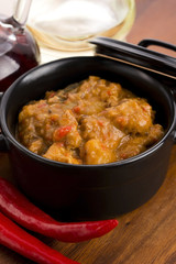 homemade hot goulash on wooden table