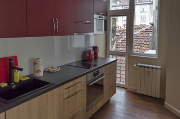 Living room with kitchen site  in renovated apartment