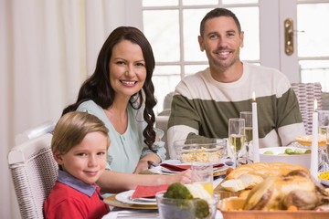 Obraz na płótnie Canvas Smiling family during christmas dinner