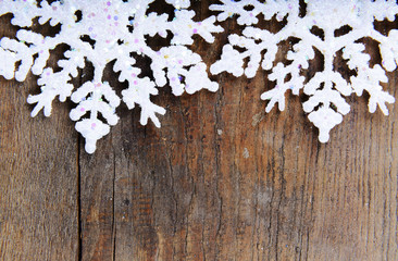 snowflakes on a wooden background