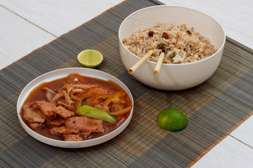 Mat with cooked rice and meat with vegetables