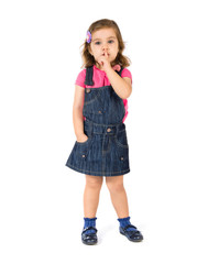 Kid making silence gesture over white background