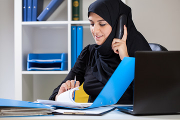 Female muslim in the office