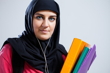 Middle Eastern student holding documents