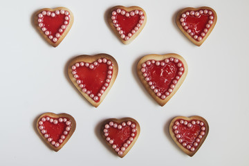 Fototapeta premium Red hearts cookies on white background