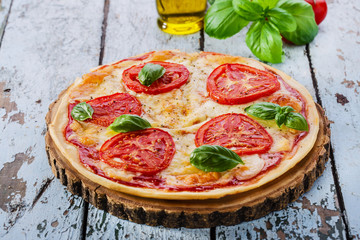 pizza with mozzarella and tomatoes