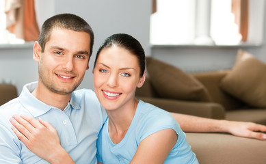Fototapeta premium Young happy smiling attractive couple at home
