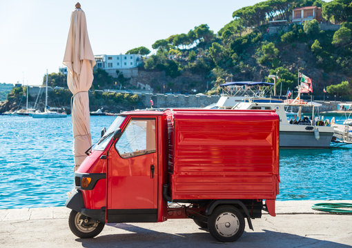 Italian symbolic red car three wheels Ape car, Elba, Italy