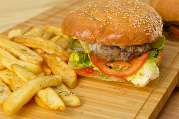 Tasty burger with melted cheese and thick succulent ground beef