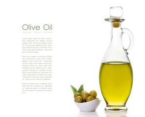 Olive Oil on Bottle with Olive Seeds on the Side