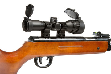 air rifle with a telescopic sight and a wooden buttb