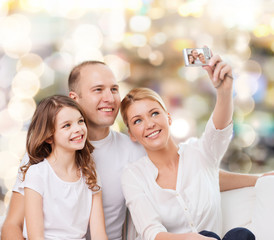happy family with camera at home