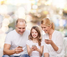 happy family with smartphones