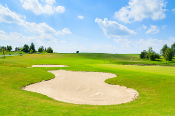 Golf course green play area on sunny summer day, Poland
