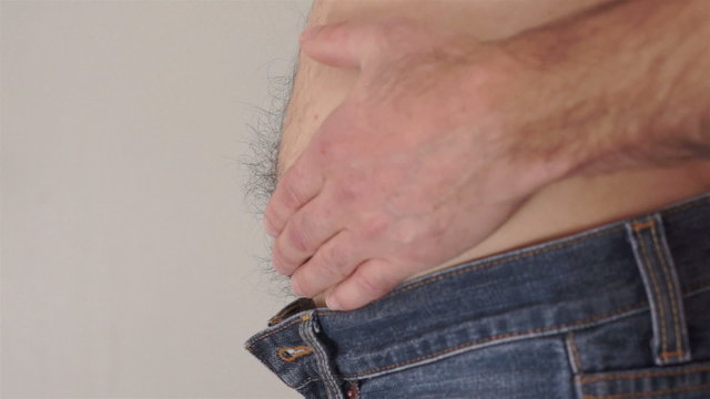 Male Rubs Bare Tummy Side View
