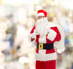 man in costume of santa claus with bag