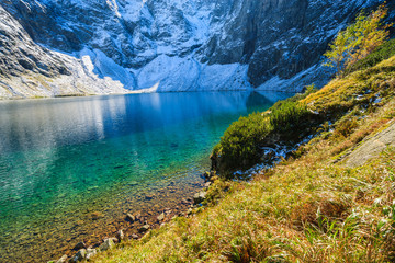 Fototapeta na wymiar Czarny Staw lake in autumn colours, High Tatra Mountains, Poland