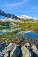 Fototapeta na wymiar Lake in Gasienicowa valley in autumn, Tatra Mountains, Poland
