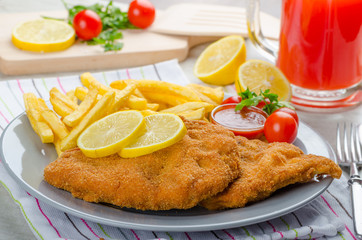 Schnitzel with french fries and a spicy dip