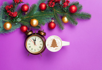 Fototapeta na wymiar cappuccino and christmas tree shape with alarm clock