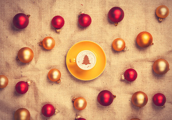 cappuccino with christmas tree shape and with red and gold chris