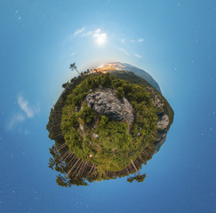 Little planet panorama at night with clouds and city light
