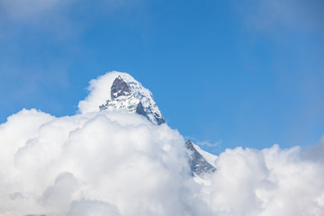 Close view of the Matrerhorn over the cloud