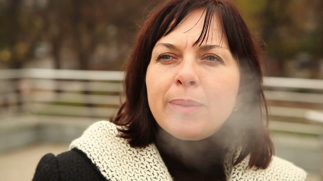 woman smokes a cigarette 1