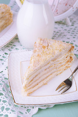 Napoleon cake on plate on table close-up