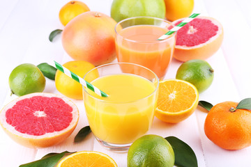 Naklejka na ściany i meble Juices and many citrus close-up