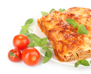 Portion of tasty lasagna, isolated on white