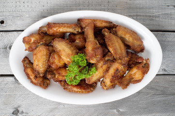 Close Up Deep Fried Chicken Wings on a wooden table