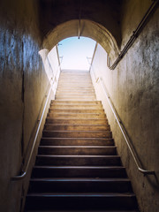 Near death experience ascend up towards the light in the dark tunnel