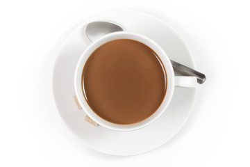 Cup of coffee with milk with spoon on white background, top view