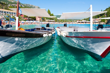 Fototapeta na wymiar Touristic boats on the Palaiokastritsa beach. Corfu.