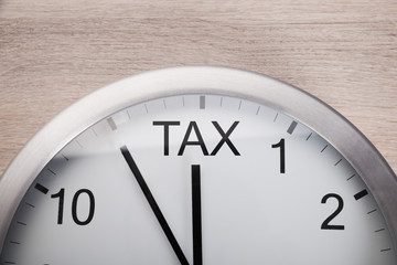 Obraz na płótnie Canvas Clock Showing Arrival Of Tax Time