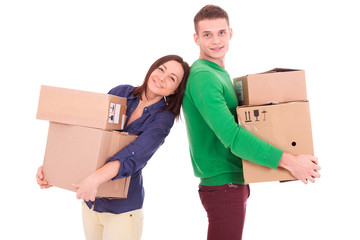 Young couple holding boxes. Moving to a new apartment or house.