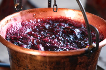 huge copper cauldron with the tasty mulled wine cooked over the