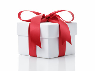 white gift box with red ribbon bow
