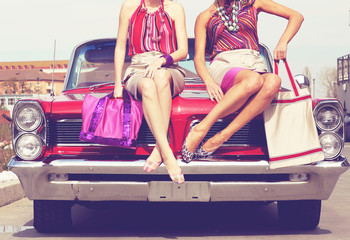 Beautiful ladies legs posing in a vintage retro car