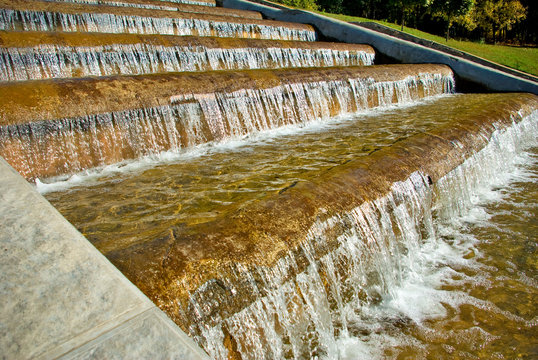 image of water flowing down the stairs in the park closeup