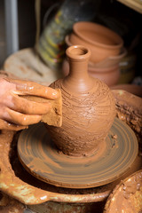 potter, creating an earthen jar