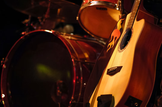 drums kit and acoustic guitar on stage