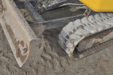 Excavator digging a hole