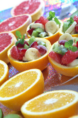 Orange bowl with colorful fruit salad