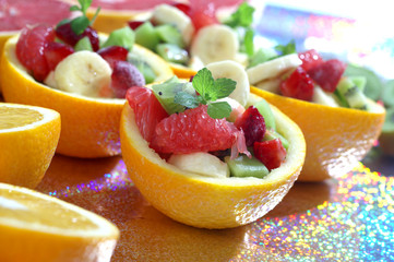 Orange bowl with colorful fruit salad - obrazy, fototapety, plakaty