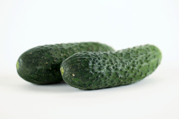 Two green piccles vegetable on white background