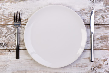 Empty plate on wooden background