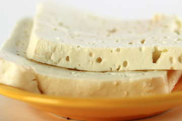 White cheese on a orange plate